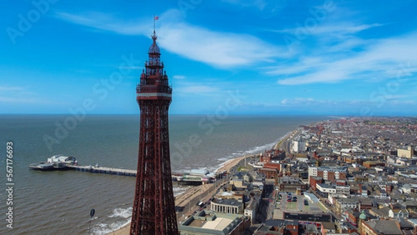 Obraz pier overhead view. Birds flying on the Ferris wheel and the pier. Waves crashing on the shore in the blue sea
