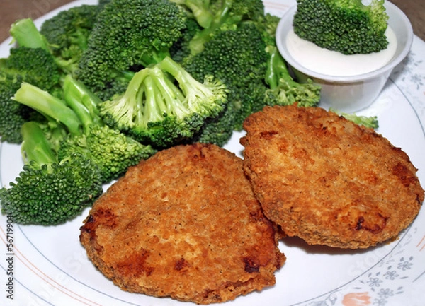 Fototapeta Crispy chicken patties with broccoli and dipping sauce