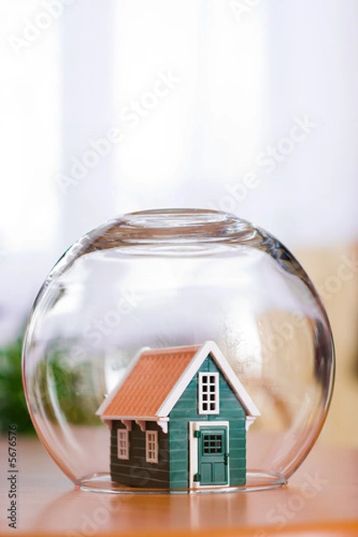 Obraz Conceptual view of protecting a house - real estate insurance