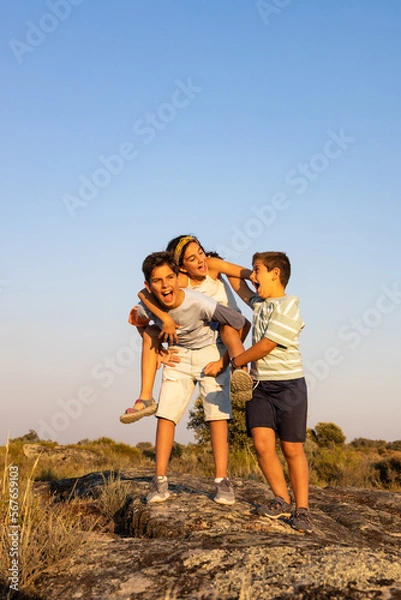 Fototapeta Three funny friends playing ina summer day