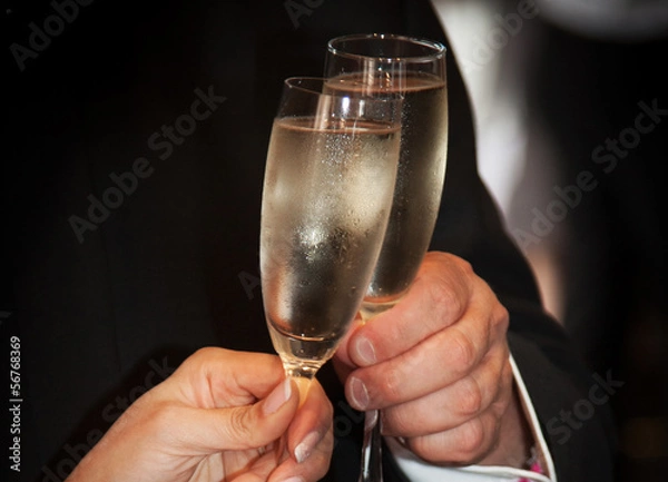 Fototapeta Champagne glasses clinking