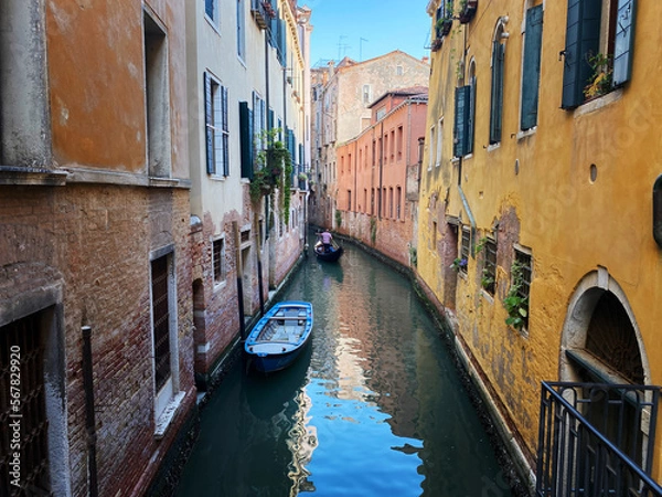 Fototapeta Canal with two gondolas in Venice, Italy. Architecture and landmarks of Venice. Venice postcard with Venice gondolas.
