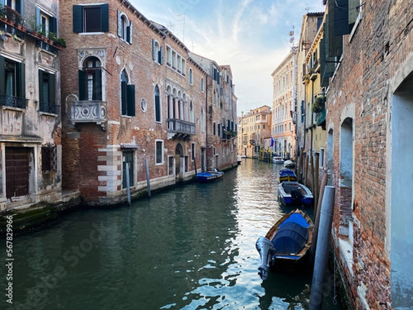 Fototapeta Canal with two gondolas in Venice, Italy. Architecture and landmarks of Venice. Venice postcard with Venice gondolas.