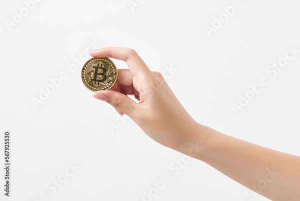 Obraz 비트코인 동전을 들고 있는 여성의 손
