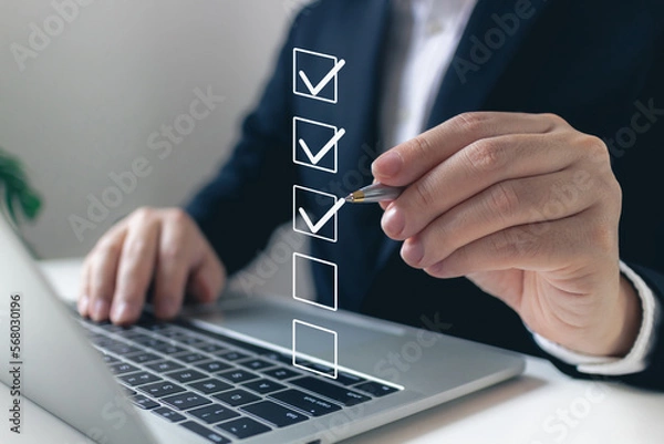 Obraz Businessman tick correct mark to approve document iso checklist icon.checkmark quality management quality assurance or QA and quality control or QC and improvement, Standardization and certification.