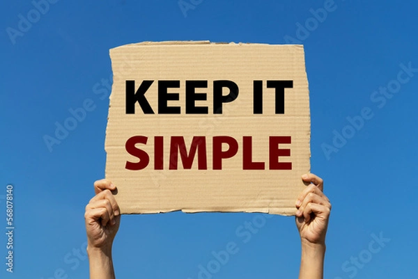 Fototapeta Keep it simple poster held by 2 hands with isolated blue sky background