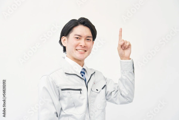 Fototapeta 上を指差す作業着の男性　白背景