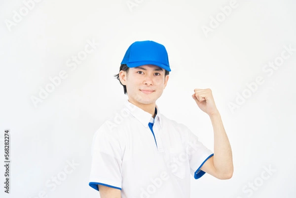 Fototapeta ガッツポーズする引越し業者の男性　白背景