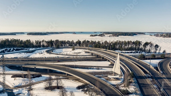 Obraz Aerial view of a freeway intersection Snow-covered in winter.Busy intersection. Birds eye view from drone. Cityscape