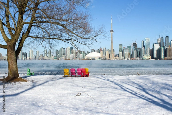 Fototapeta Picturesque city skyline landscape from Toronto Islands in winter in 2023