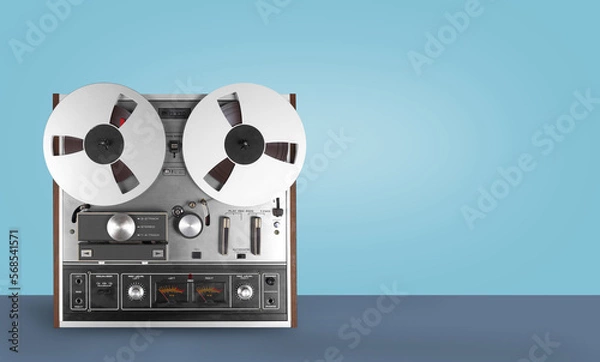 Obraz Vintage Music and sound - Retro reel to reel tapes recorder blue background
