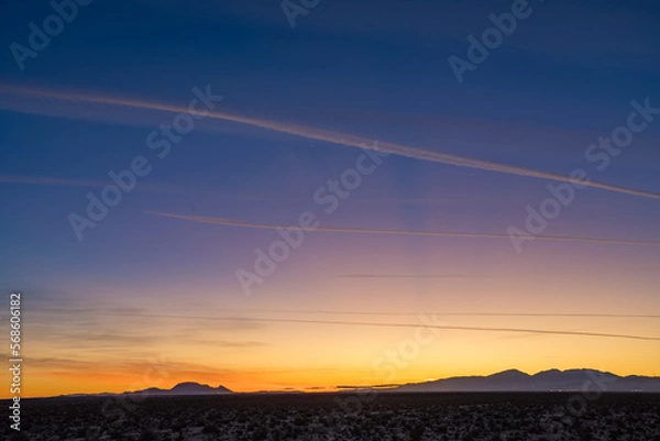 Obraz Orange purple gradient over mojave desert sunset with moutains