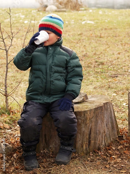 Obraz young boy drinking hot chocolate