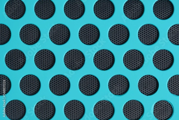 Obraz Bright turquoise background with round, black cells shape honeycombs.