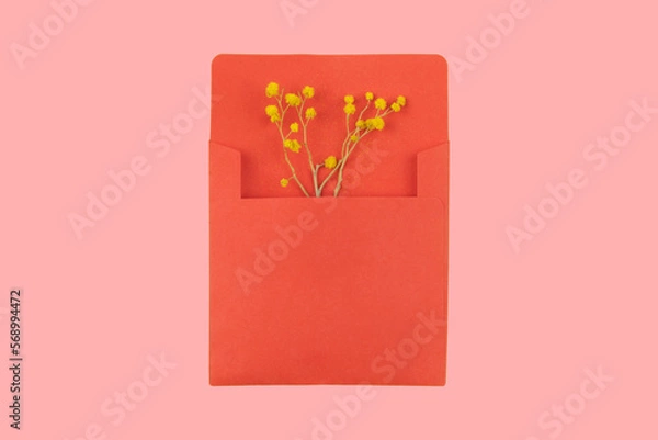Obraz Artistic Composition of Flowers in Envelope. A red envelope with yellow flowers, suitable for greetings and celebrations like Valentine's Day or Mother's Day.