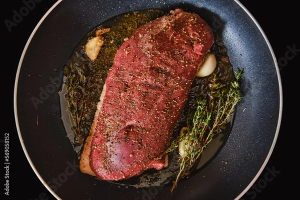 Obraz Top view of duck breast in a frying pan