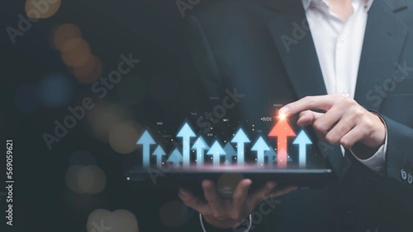 Fototapeta Businessman showing business growth and success graph ,concept of progress in development, financial efficiency and investment with business strategy for goals and opportunities in the industry future