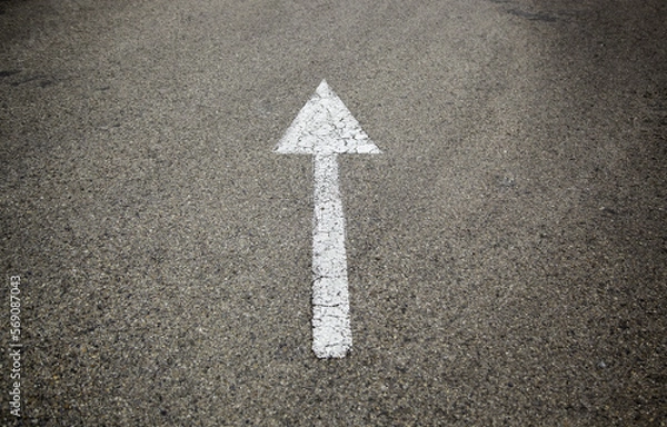 Fototapeta Direction arrow on the asphalt