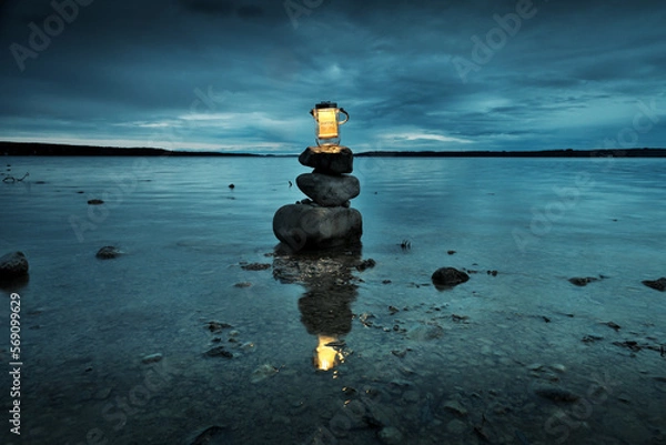 Fototapeta burning candle on the sea, travel, to yourself, light in the darkness, lighthouse, self-discovery, yoga, zen, light, consciousness, become conscious, licht in der dunkelheit,