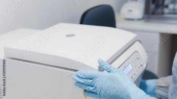 Fototapeta person using centrifuge molecular biology