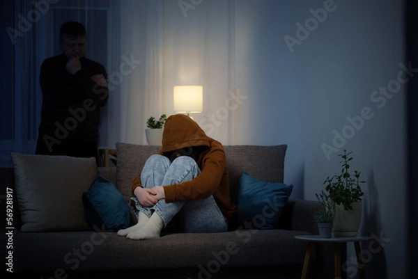 Obraz father and daughter teenager in  living room in  evening,  concept of problems in family