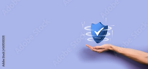 Fototapeta Businessman hold low poly polygon shield with a tick icon.Secure Access System Concept.Business Financial Warranty for Investment.antivirus concept.Technology security.Protection network,safe data.