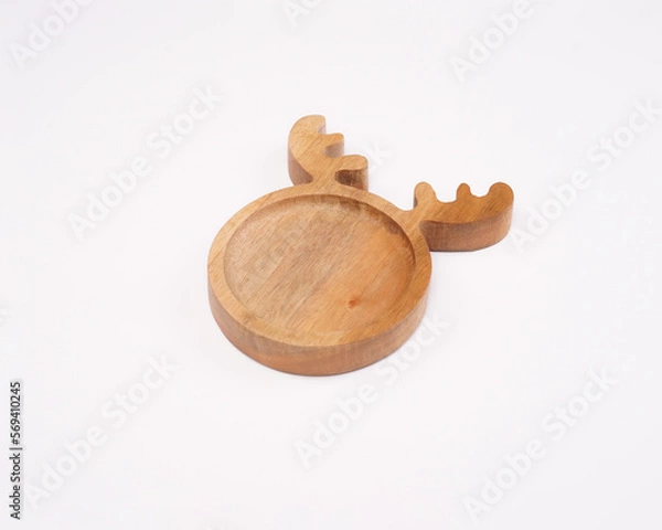 Obraz cute plates that are shaped as attractive as possible so that children are excited to eat. aesthetic plate made of wood crafts. the result of a cnc router machine with a computerized process.