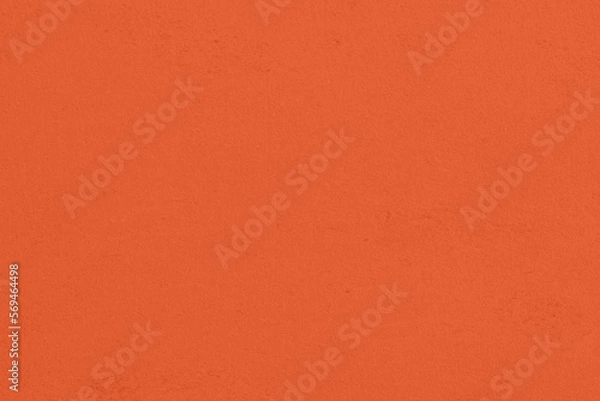 Fototapeta Saturated pastel orange colored low contrast Concrete textured background. Empty colourful wall texture with copy space for text overlay and mockups. 2023, 2024 color trend