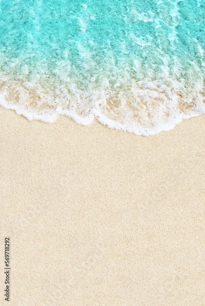 Fototapeta Soft ocean wave on white sand beach background