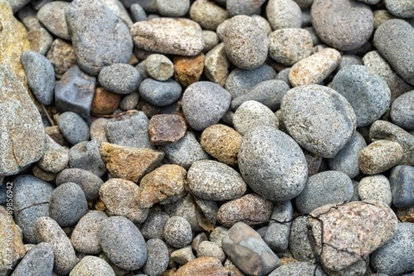 Fototapeta round rocks and pebbles on the beach in australia