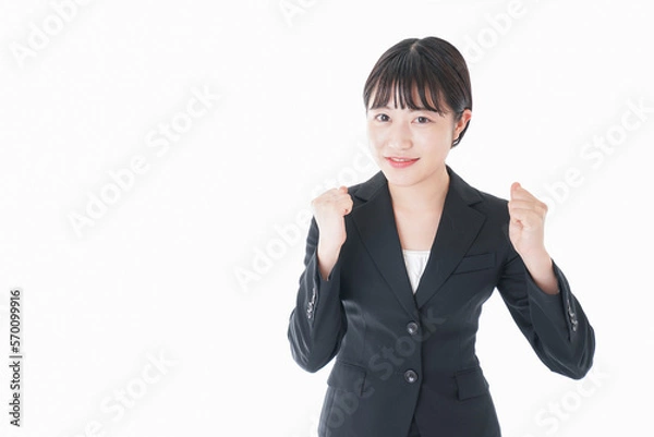Fototapeta ガッツポーズをするビジネスウーマン