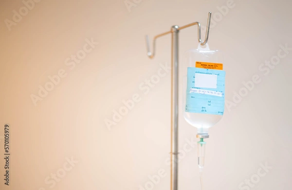 Fototapeta The saline bag hanging on the IV pole in the emergency room at the hospital.