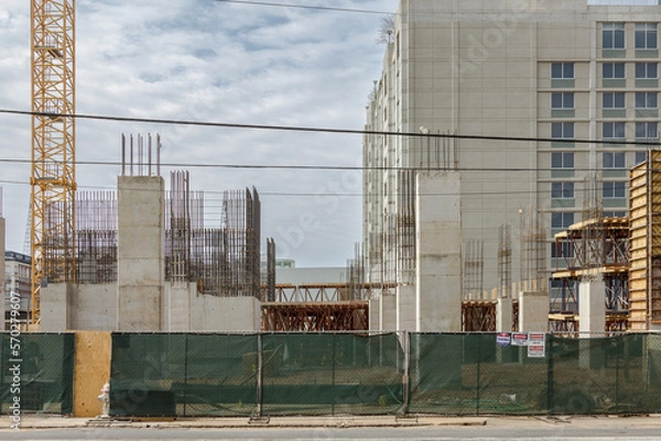 Obraz Fenced off construction site of a multistory apartment building