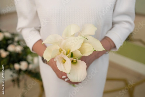 Obraz Bride's bouquet in the hands of the bride