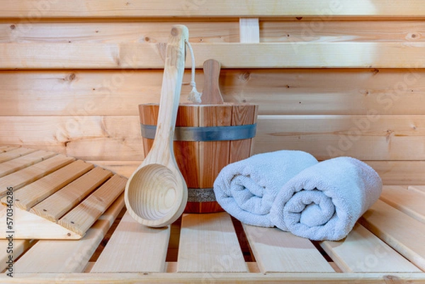 Obraz Detail from buckets and white towels in a sauna, wellness accessories