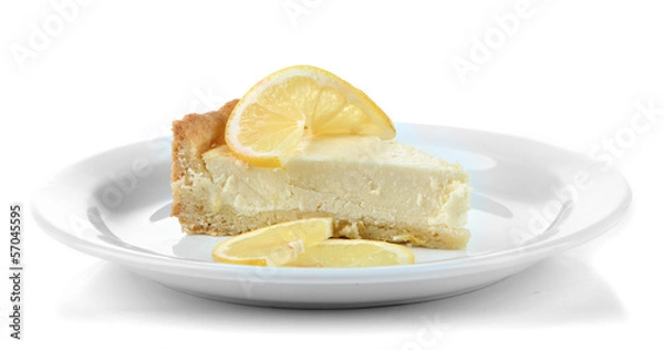 Fototapeta Slice of  lemon cheesecake on plate, isolated on white