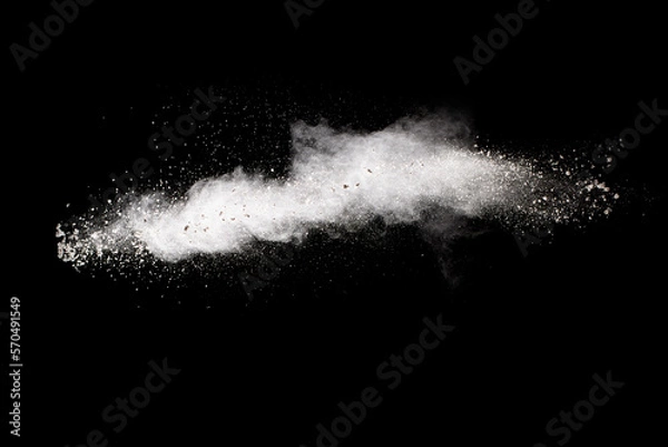Fototapeta White powder explosion cloud against black background. White dust particles splash.