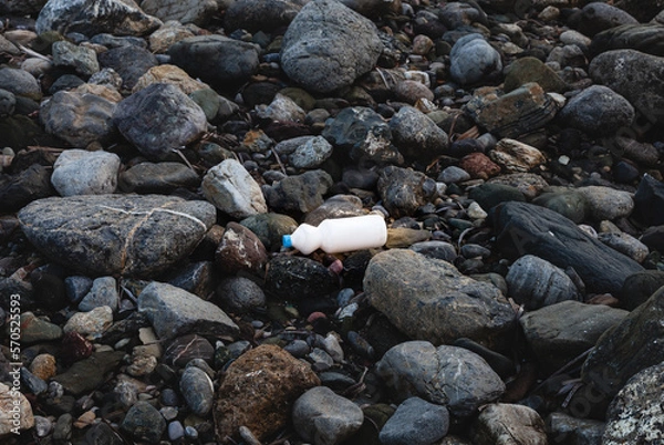 Obraz Environmental pollution. White plastic packaging on the seashore