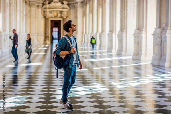 Obraz Handsome Man Holding a Guide Inside a Museum