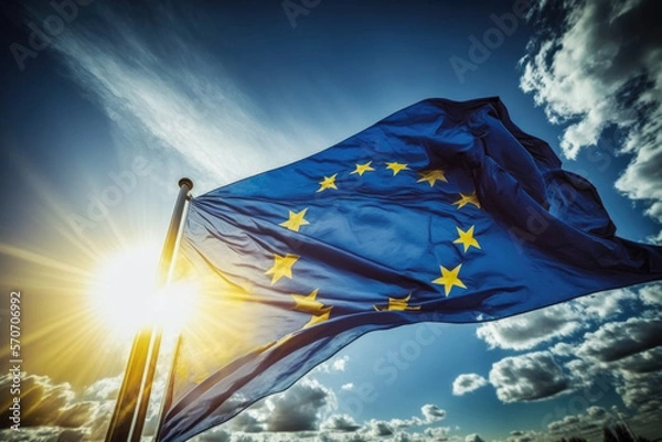 Fototapeta European Union flag developing against the background of the sky and the sun. Created with Generative AI technology.