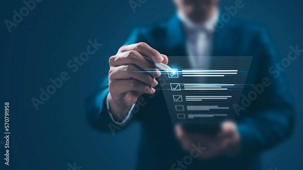 Fototapeta Business performance monitoring concept, businessman using smartphone Online survey filling out, digital form checklist, blue background.