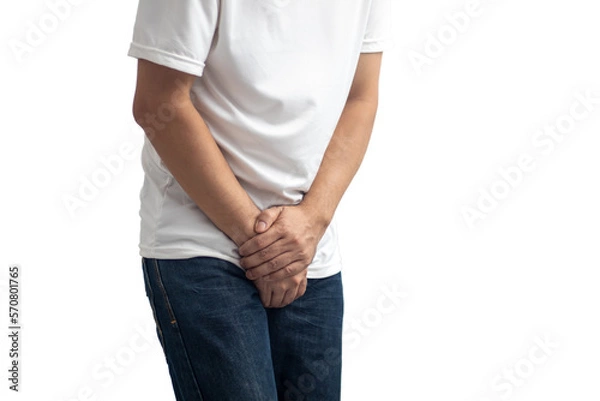 Obraz The man touched the crotch of his pants with pain. transparent background