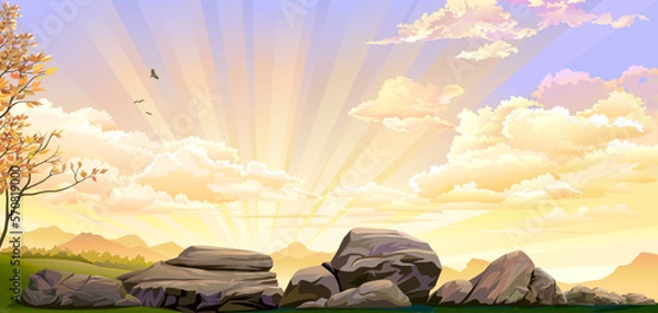 Fototapeta Big rocks on green meadows with sunset in the background.