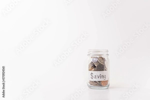 Fototapeta Pile of money coins in piggy bank with white background, saving money and financial concept, copy space