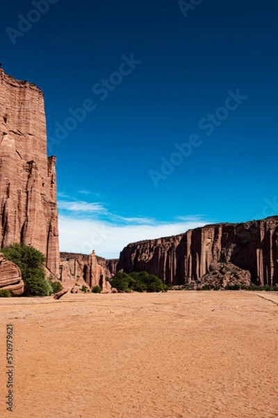 Obraz dirt road with footprints arid, hot and desertic place in the cayon de talampaya rich in fossils dinosaurs triassic era argentina