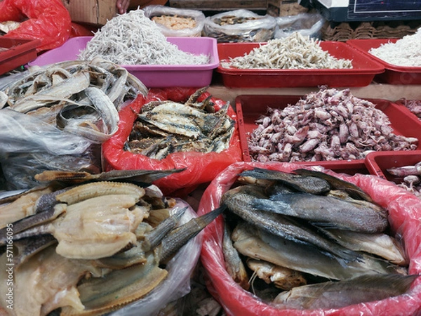 Fototapeta Dry salted cod fish or ikan asin for sale at market, is fish cured with dry salt and thus preserved for later eating