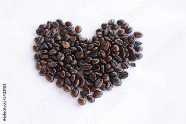 Fototapeta Coffee beans in the shape of a heart on white background