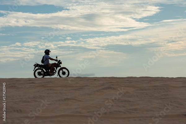 Fototapeta person riding a bike