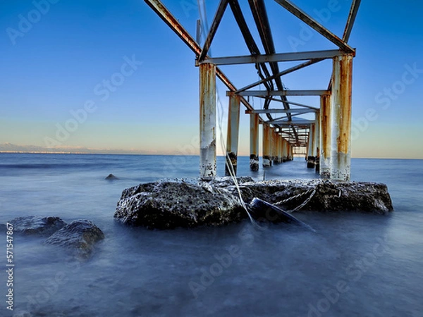 Fototapeta Rocks under the pier