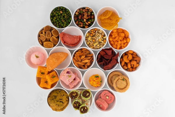 Fototapeta Assorted Indian Sweets And Snacks Like Gujiya, Chandrakala, Kalash Gujia, Suryakala, Rose Karanji, Potli Gujia, Chandrakala, Laung Latta, Samosa Gunjiya, Khoa Gughara, Khoya Pedakiya, Namkeen, Bhujiya